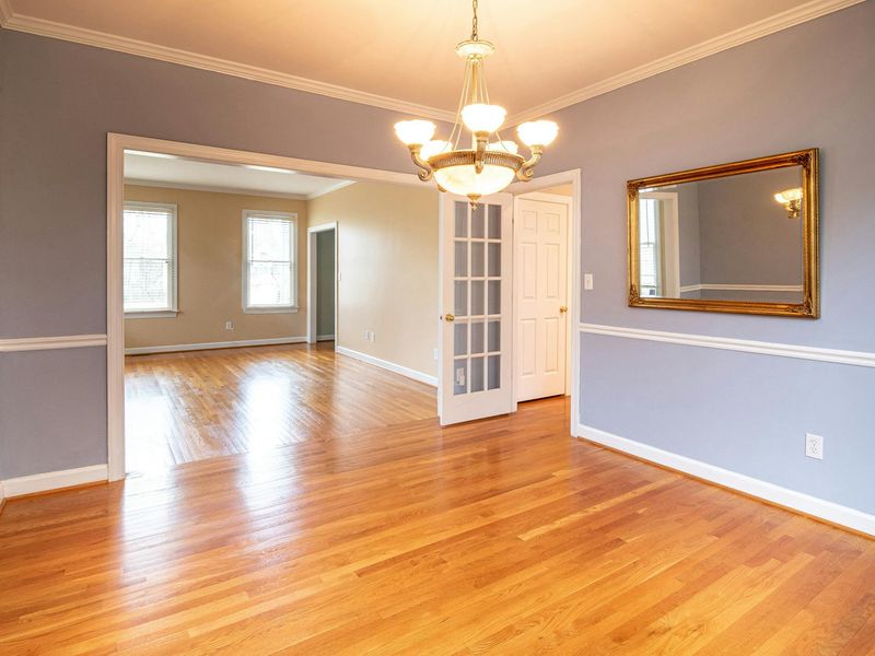 Spacious, bright room with wooden floors, suitable for home workouts.